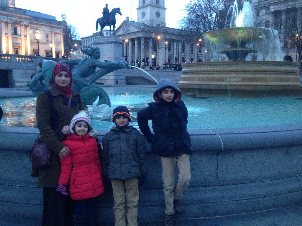 In front of a fountain in Trafalgar Square