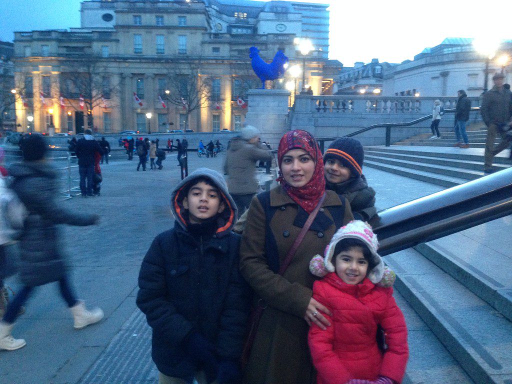 In front of a blue chicken in Trafalgar Square